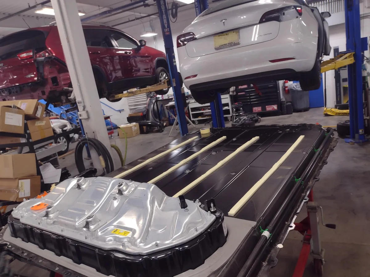 EV battery pack removed in workshop